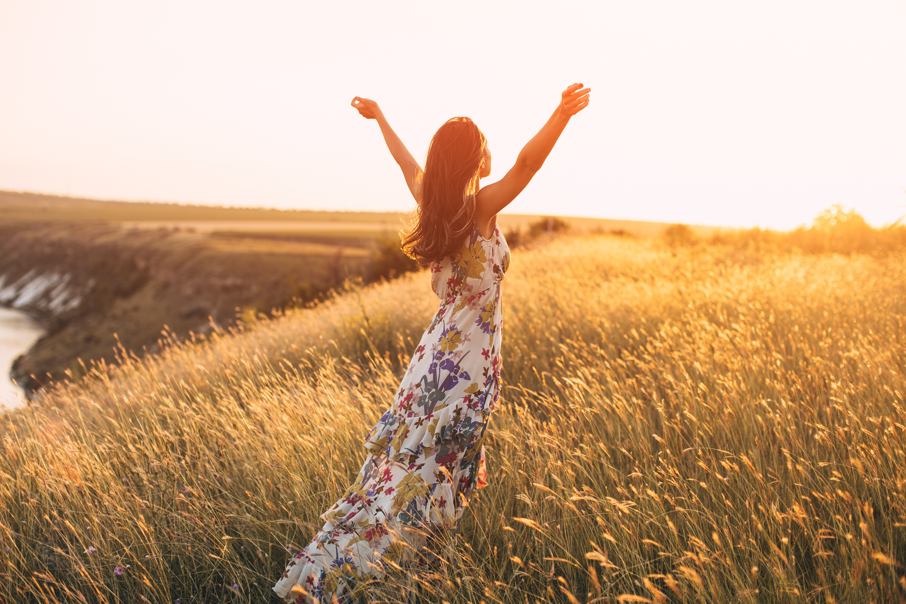 Back view of free Happy Woman Enjoying Nature.